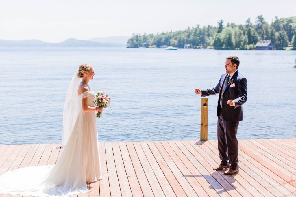 Bride and groom first look on a dock