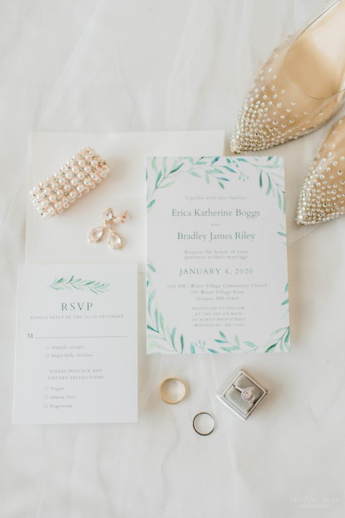 Wedding invitations and shoes and jewelry