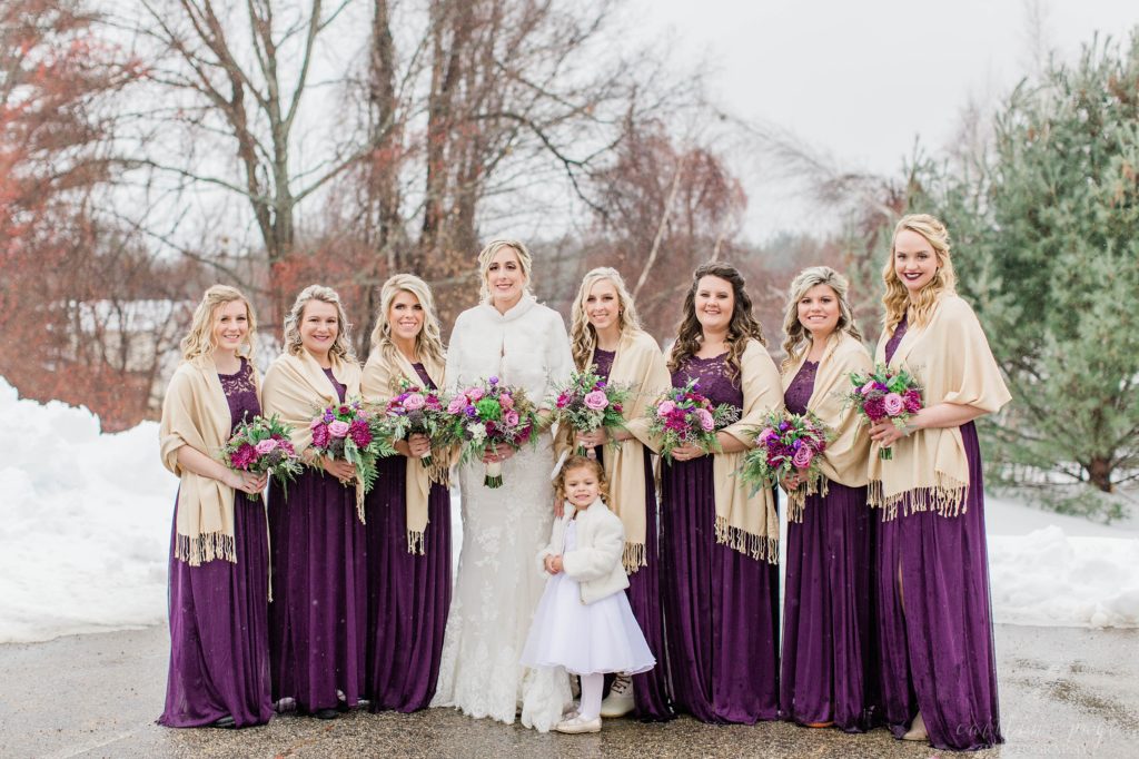 Bride and bridesmaids in purple dresses