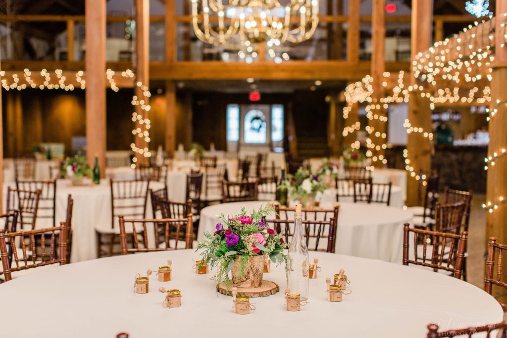 Wedding reception in a barn with purple details