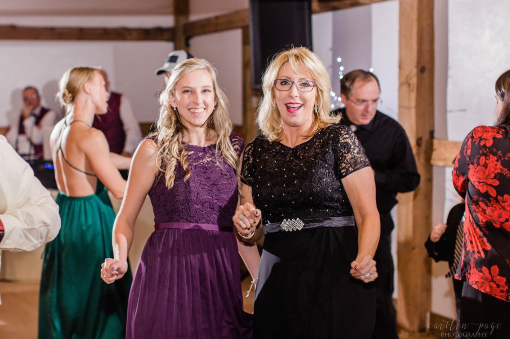 Reception in a barn with dancing guests