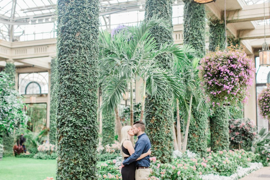 Man and woman standing in front of floral display at Longwood Gardens