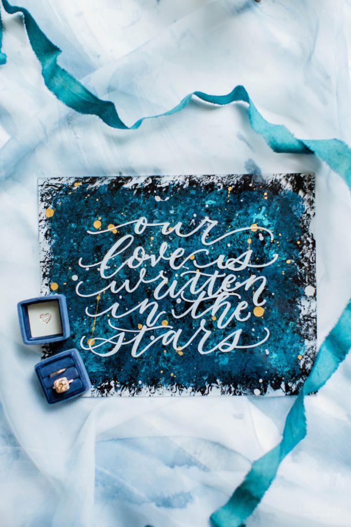 Styled elopement details with watercolor sign