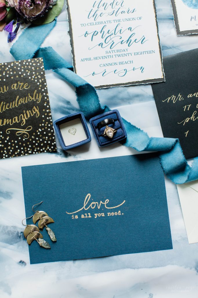Styled elopement invitation suite with blue accents
