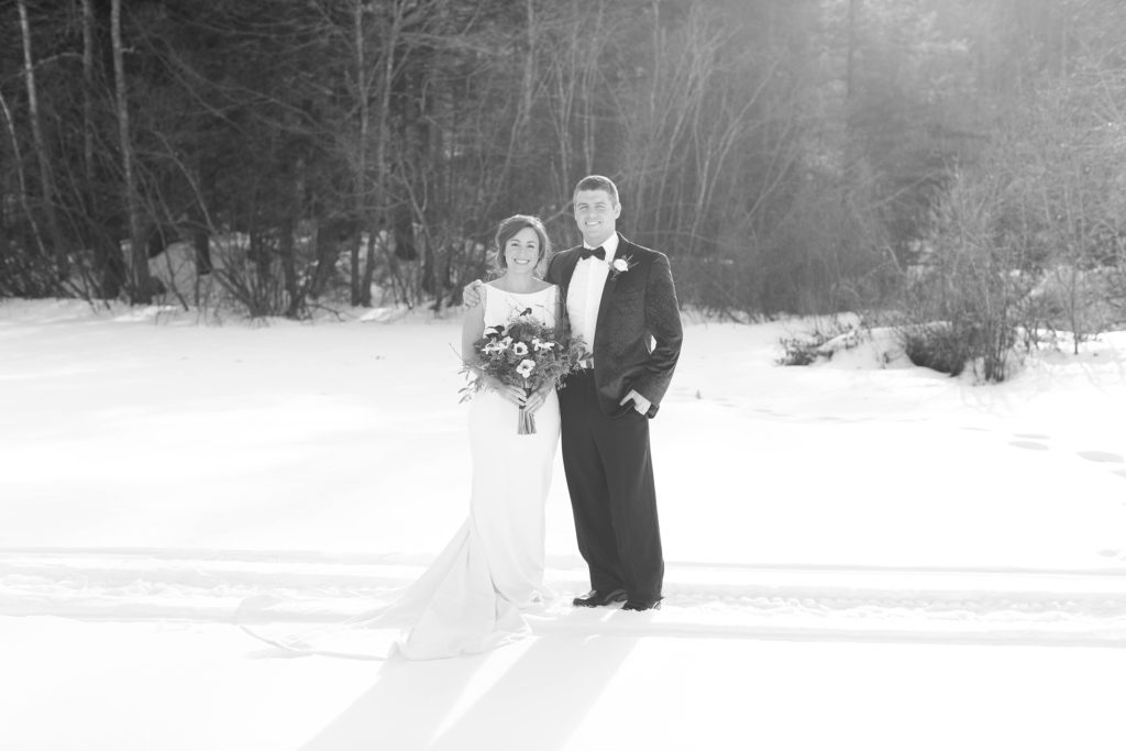 Couple portrait on frozen lake in Wolfeboro New Hampshire