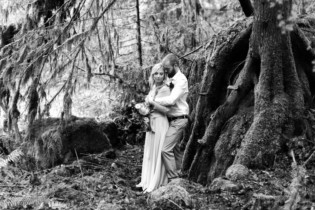 Black and white portrait of man and woman in the woods