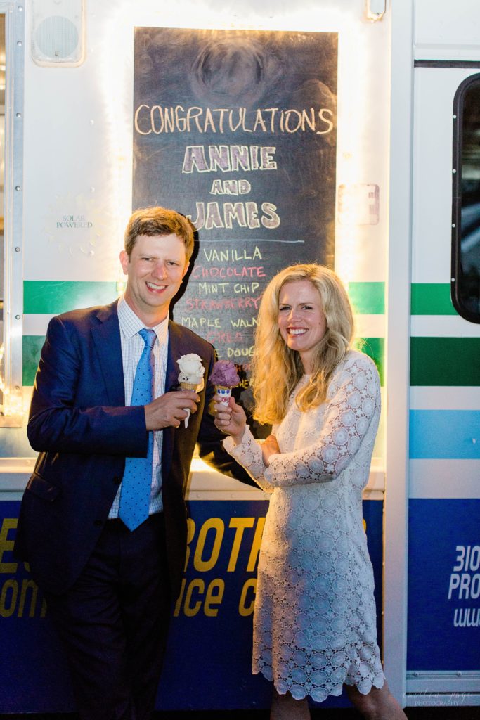 Bride and groom standing in front of ice cream truck