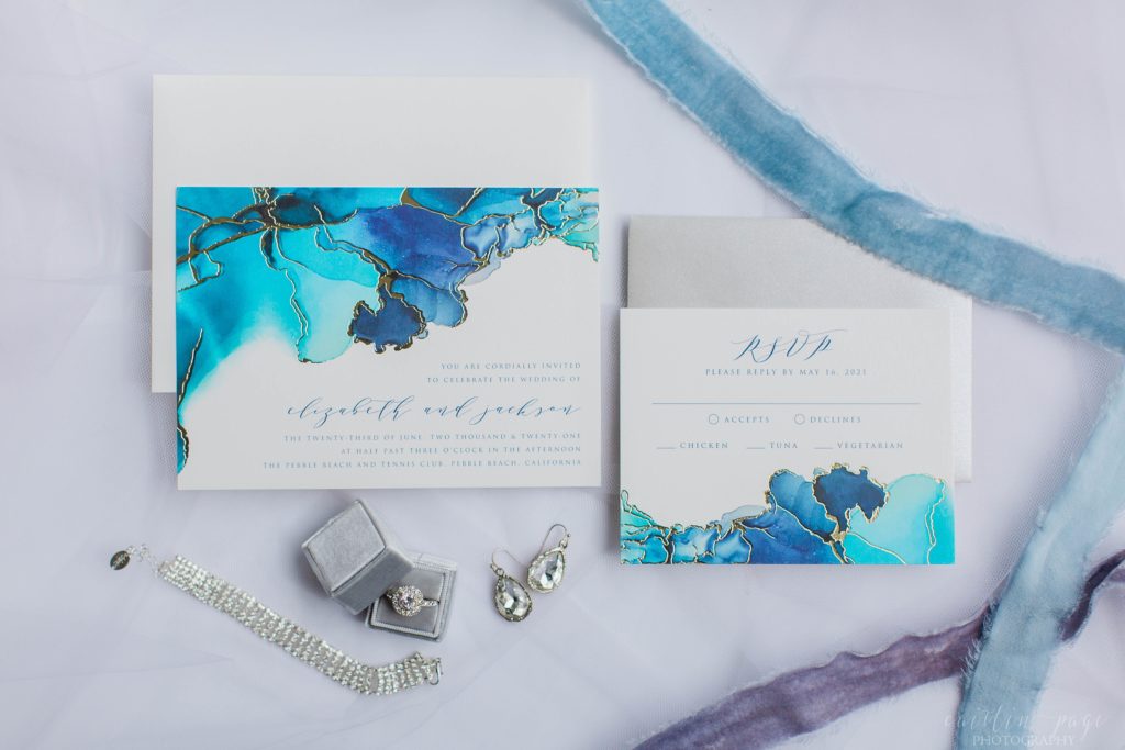 Blue and agate invitation with wedding rings and ribbons