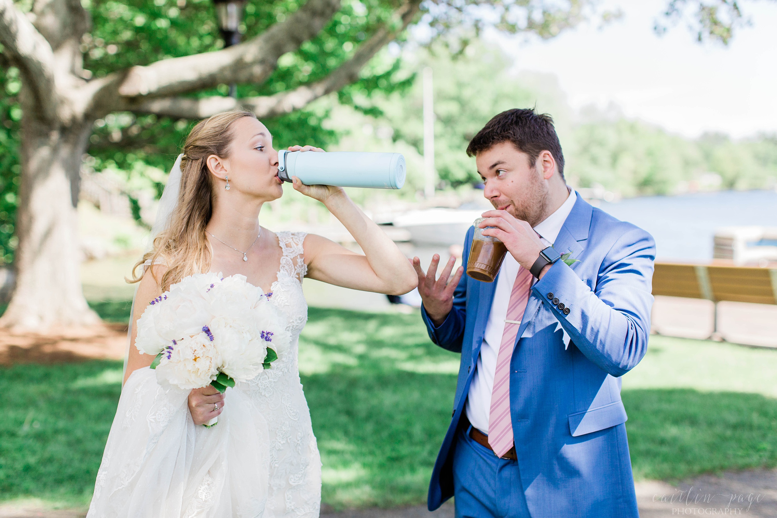 Bride and groom drinking cold drinks on wedding day
