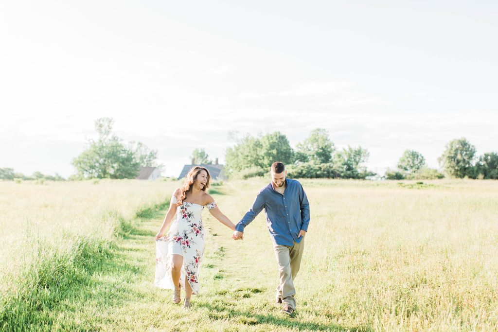 Man and woman walking through field together