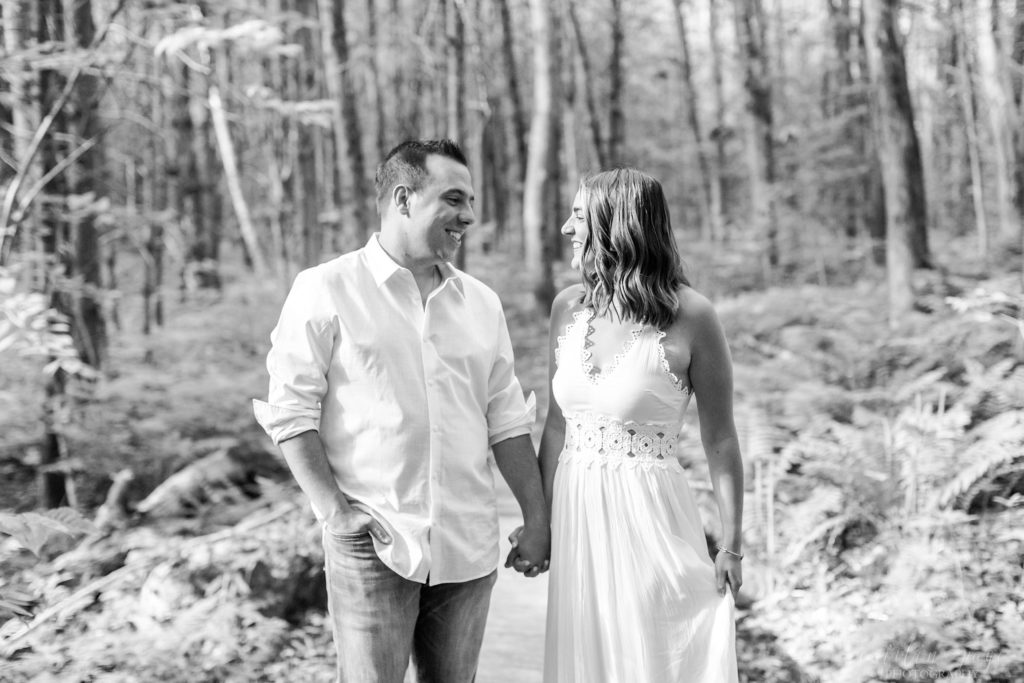 Black and white photo of man and woman looking at each other