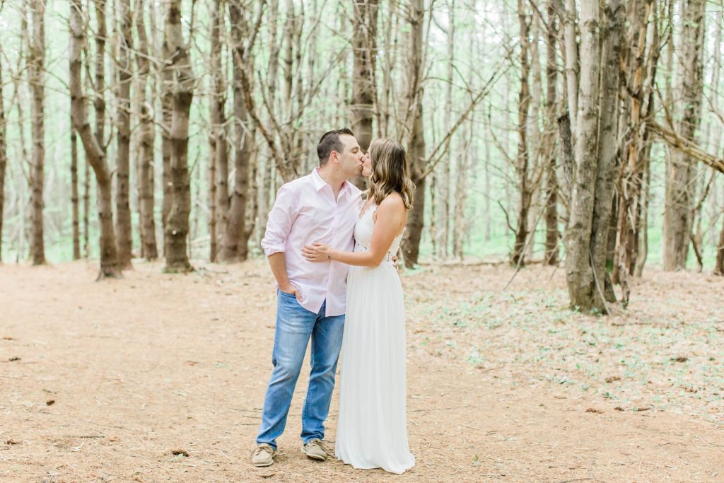 Man and woman standing in the middle of dead trees