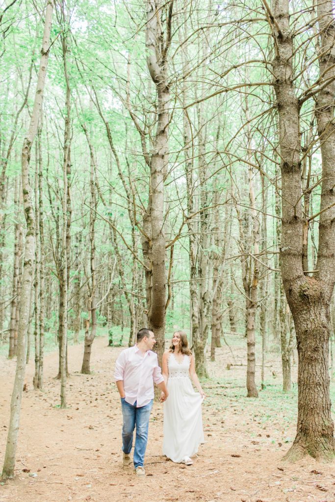 Man and woman walking through the woods together