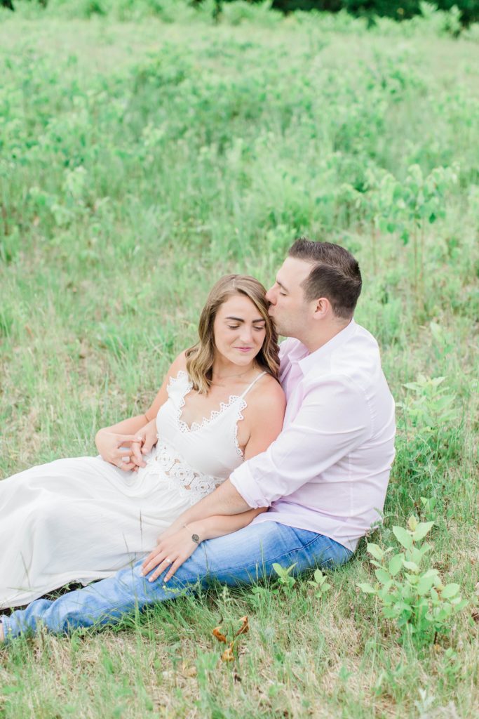 Man and woman siting together in field