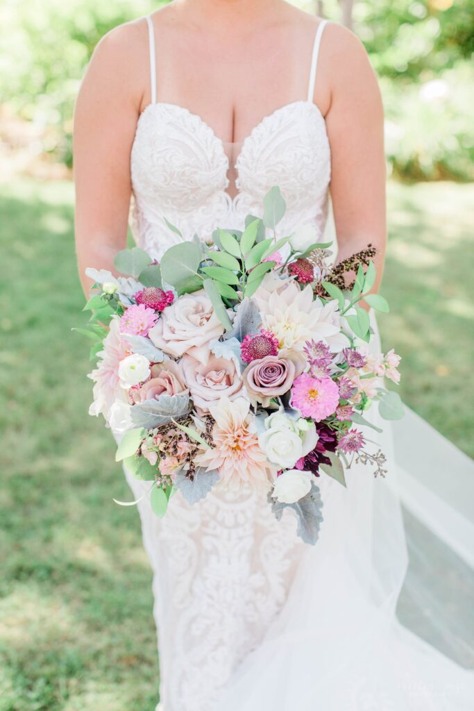 Pink textured wedding bouquet with dahlias and lisianthus