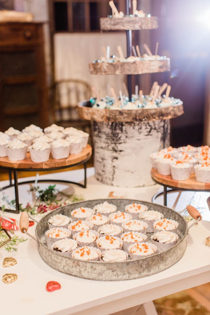 Wedding dessert table setup with cupcakes