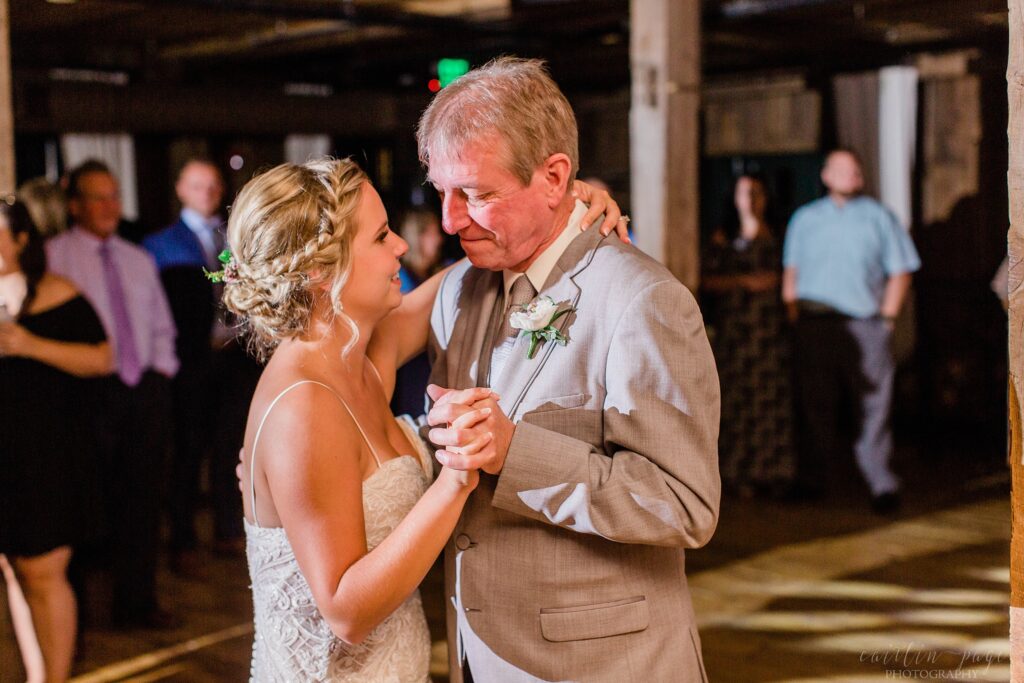 Parent dances during wedding reception at the Barn on the Pemi