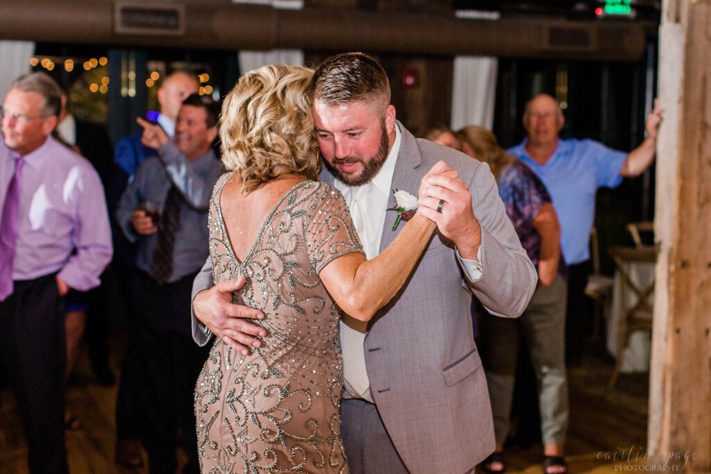 Parent dances during wedding reception at the Barn on the Pemi