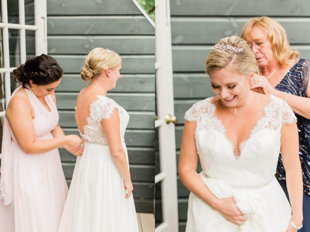 Bride being zipped into dress