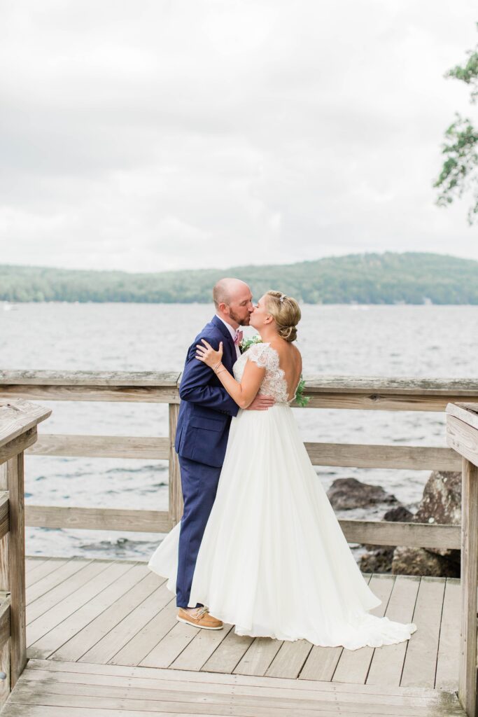 First look between bride and groom on town docks at Church Landing