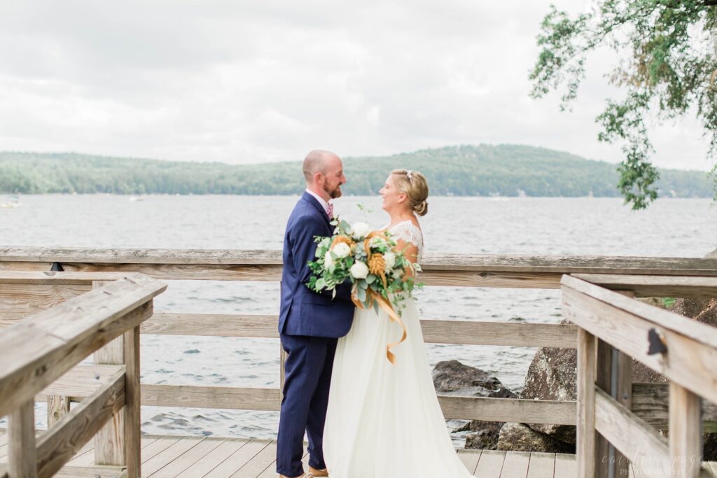First look between bride and groom on town docks at Church Landing