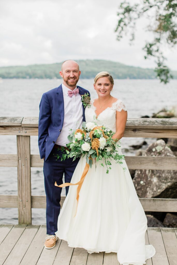 Portrait of bride and groom on town docks at Church Landing