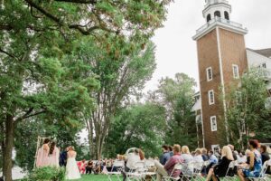 Bride and groom standing during wedding ceremony at Church Landing