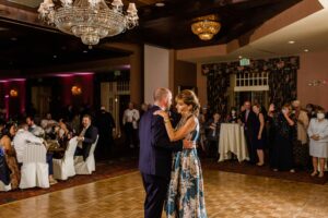 Groom dancing with his mom at wedding reception