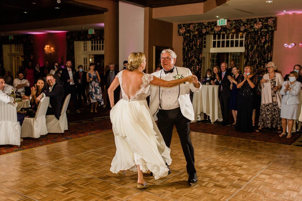 Bride dancing with her dad at wedding reception
