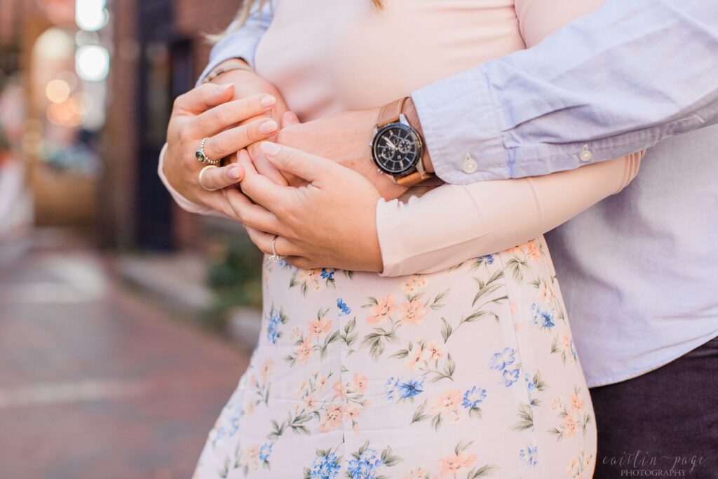 Couple standing in brick alley in Portsmouth