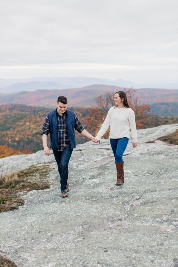 Couple walking together on mountain top