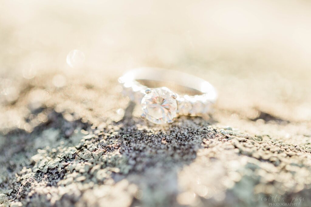 Engagement ring on top of granite rock