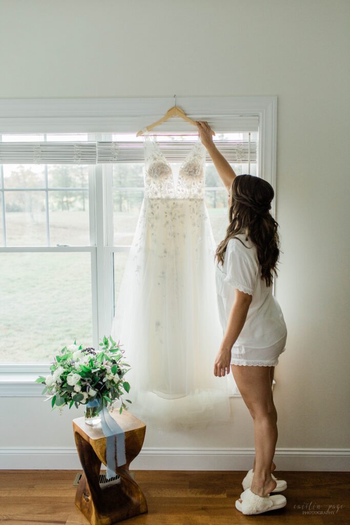Bride holding her dress