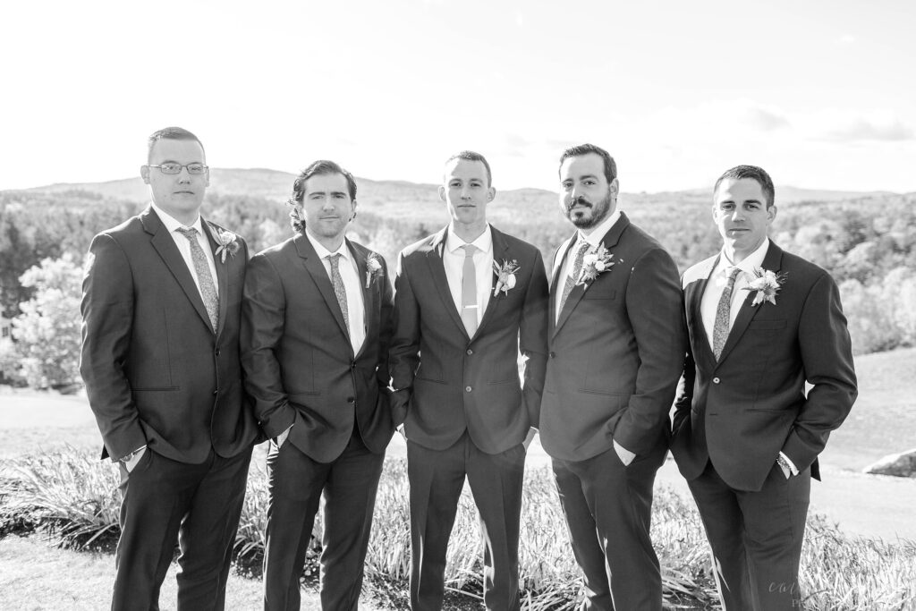 Black and white portrait of groomsmen standing together