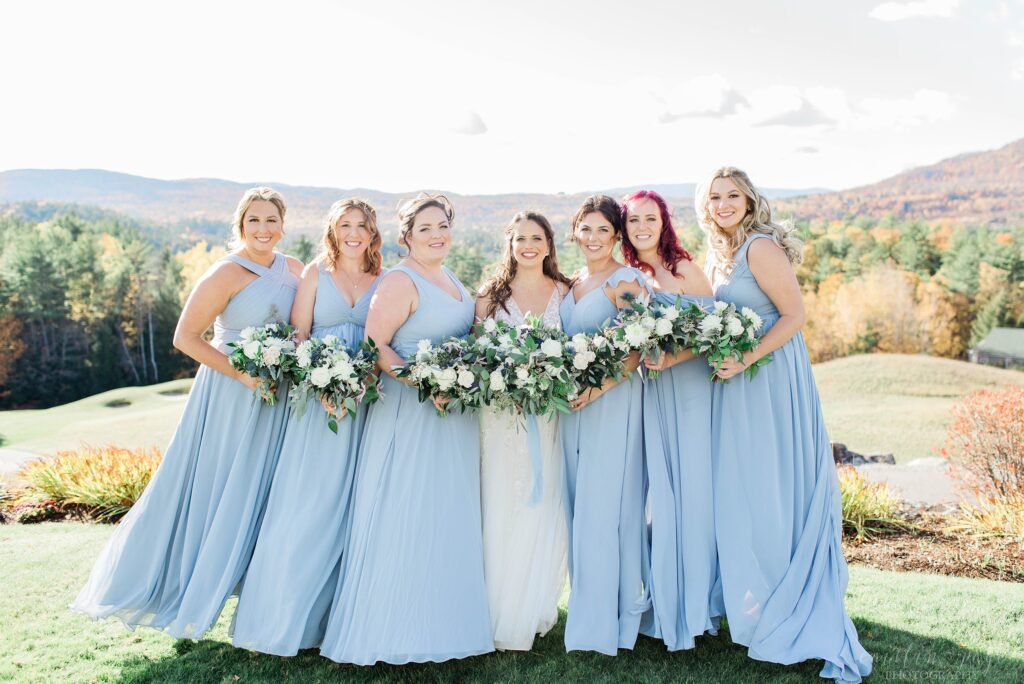 Bridesmaids and bride standing together