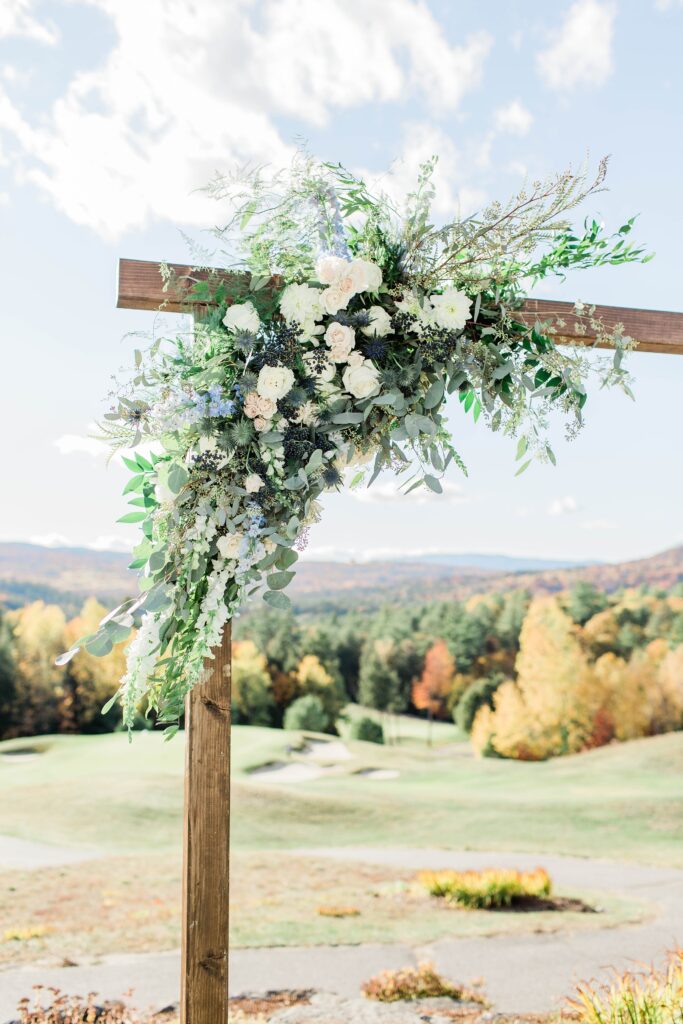 Floral accent on ceremony arch at Owl's Nest