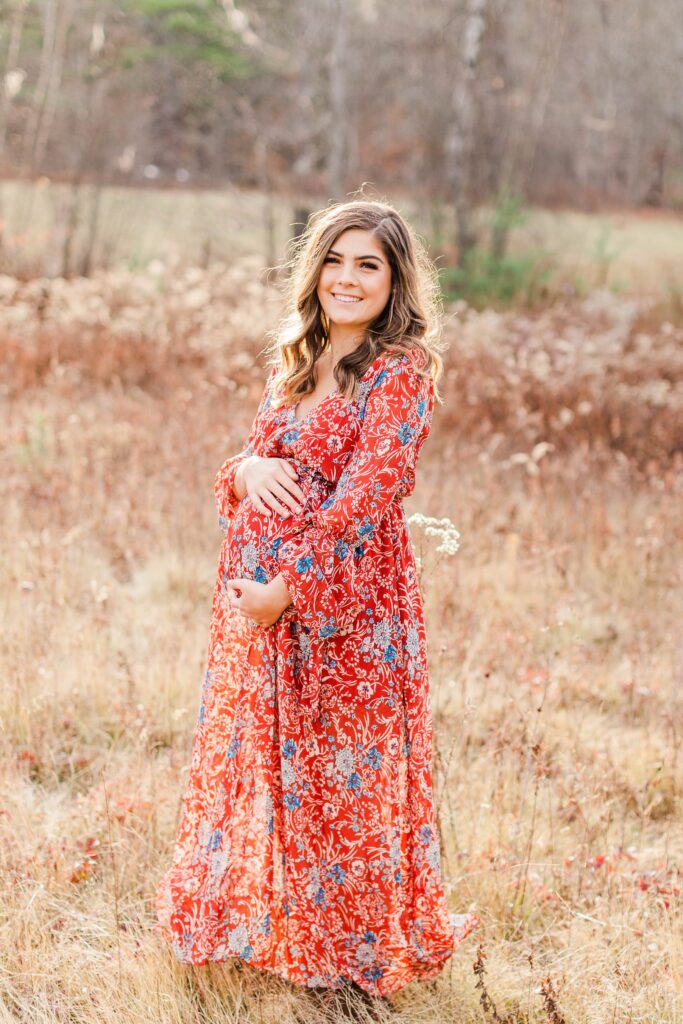 Pregnant woman standing in a field