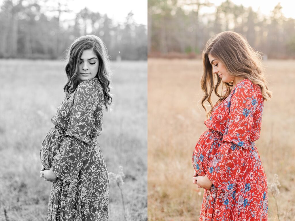 Pregnant woman standing in a field at sunset