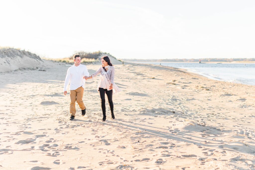 Couple walking together on beach at Plum Island