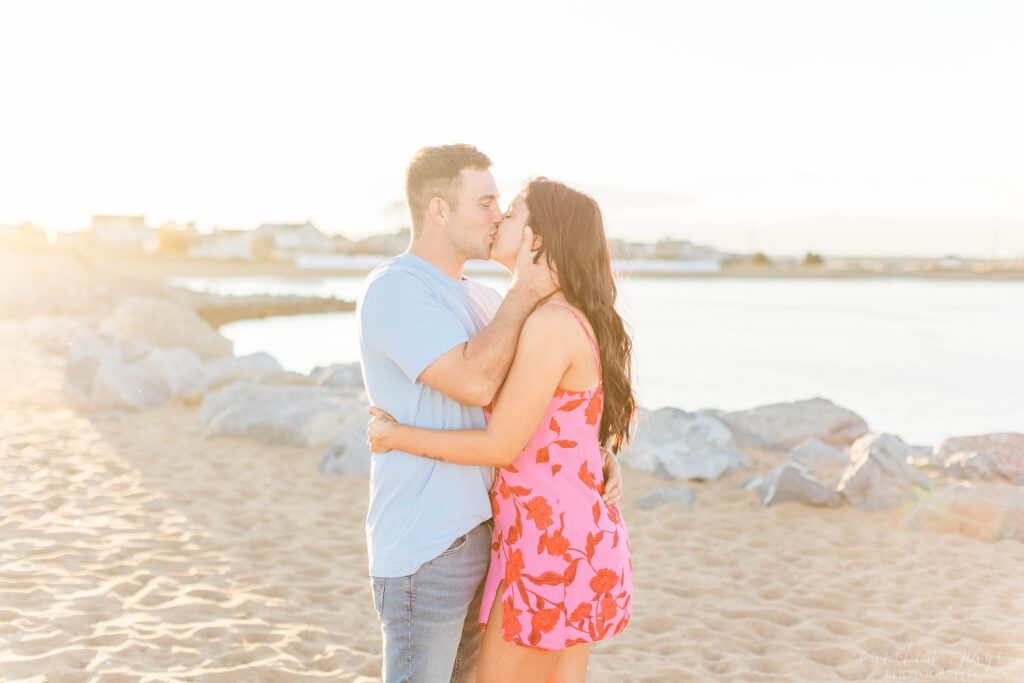 Couple kissing at sunset on Plum Island beach