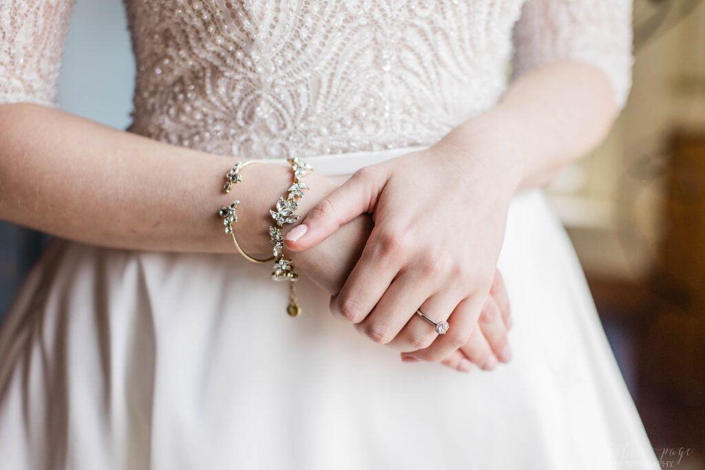Bride standing holding her hands together