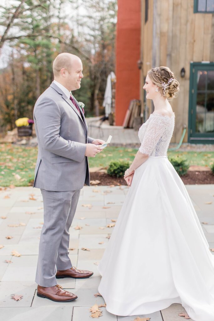 Bride and groom reciting private vows to each other at first look