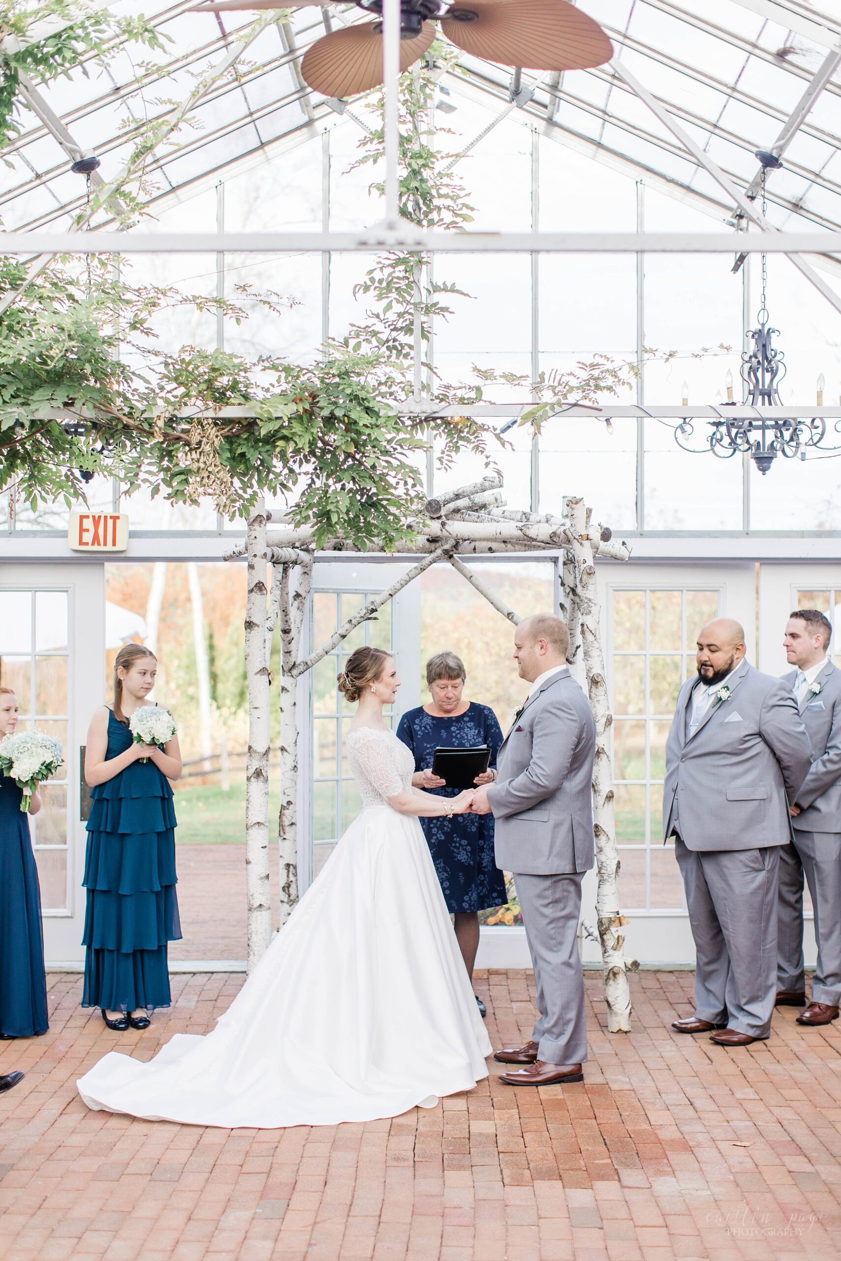 Wedding ceremony in the greenhouse at Barn on the Pemi