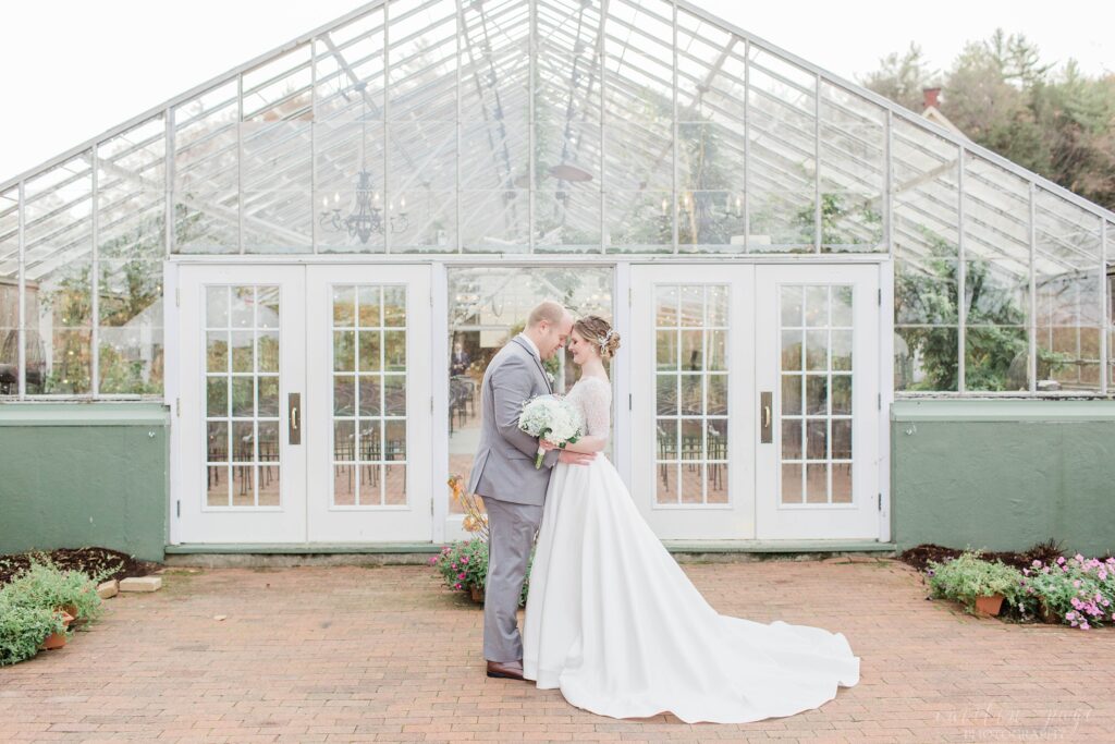 Bride and groom wedding portraits at greenhouse