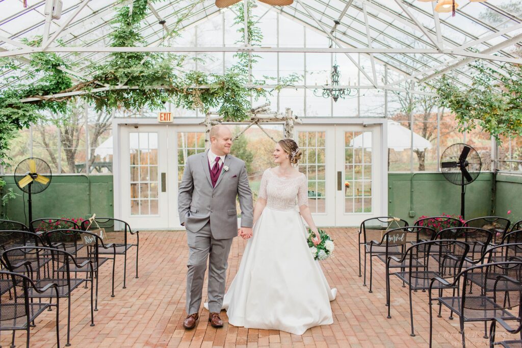 Bride and groom wedding portraits at greenhouse