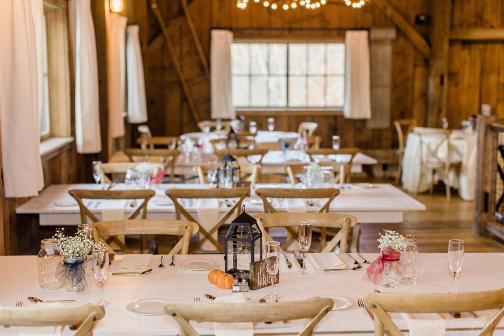 Fall wedding reception decor in barn