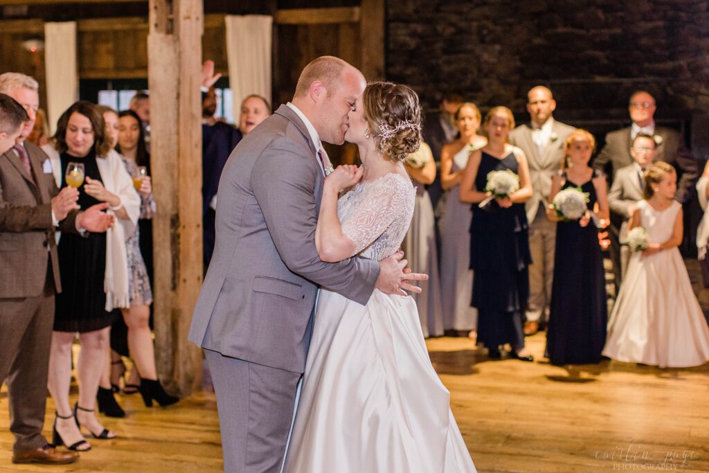 Bride and groom first dance in barn
