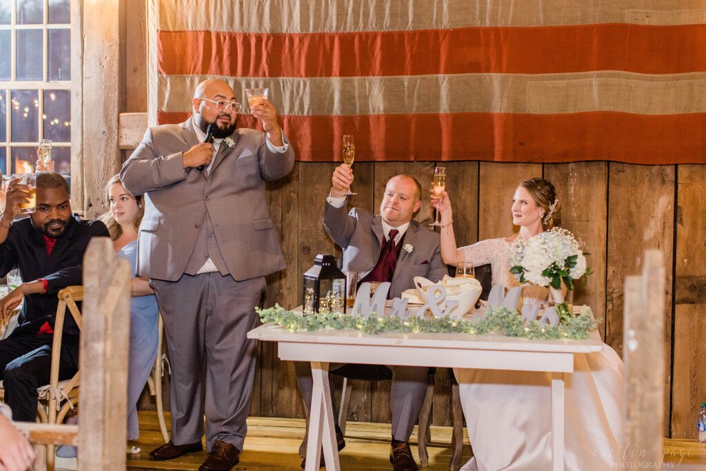 Best man giving toast to bride and groom