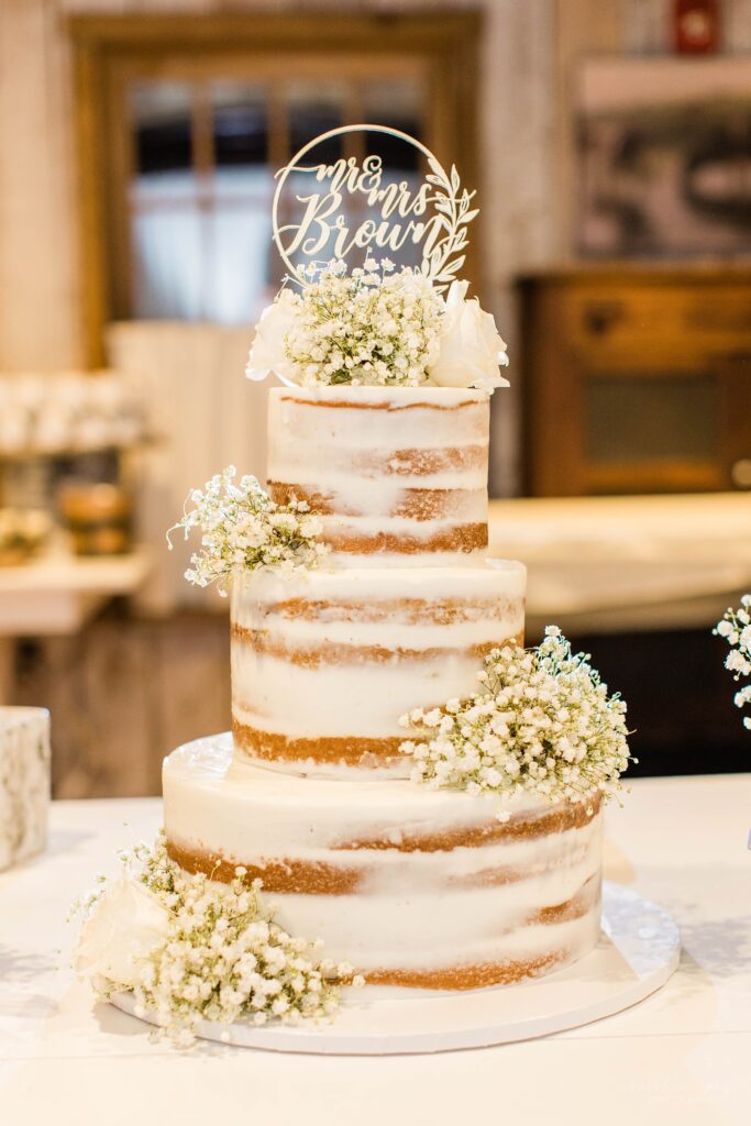 Naked wedding cake with baby's breath