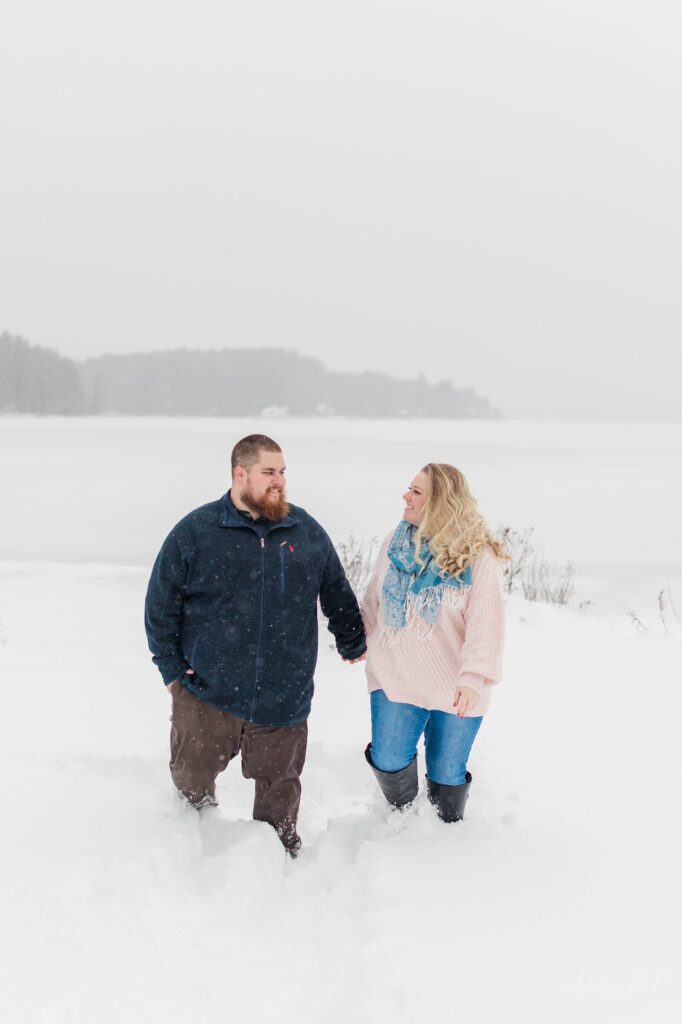 Man and woman walking in the snow together